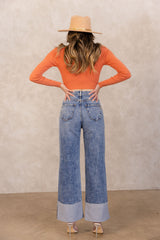 Our vintage stone washed high rise jeans serve major circa 90's vibe, with a perfect form fit. These jeans can be one of yours and your moms favorite styles! These jeans have an oversized wide cuff this look can be style for day or night. Have fun in our favorite mom jeans, the 90's Revival!